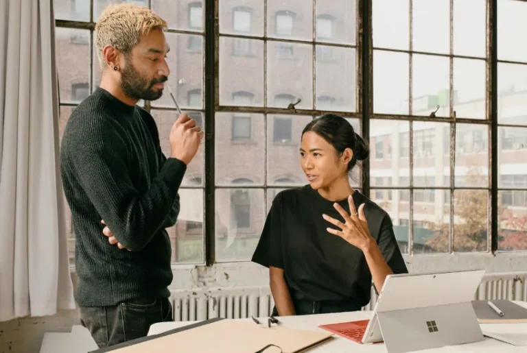 Image showing 2 people brainstorming at work